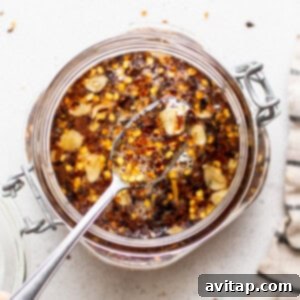 Homemade hot honey sauce poured into a jar, ready to cool and be used.