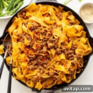 Saucy, spicy Gochujang Pork Noodles with a rich gochujang-based sauce, pappardelle noodles, ground pork, and green onions.