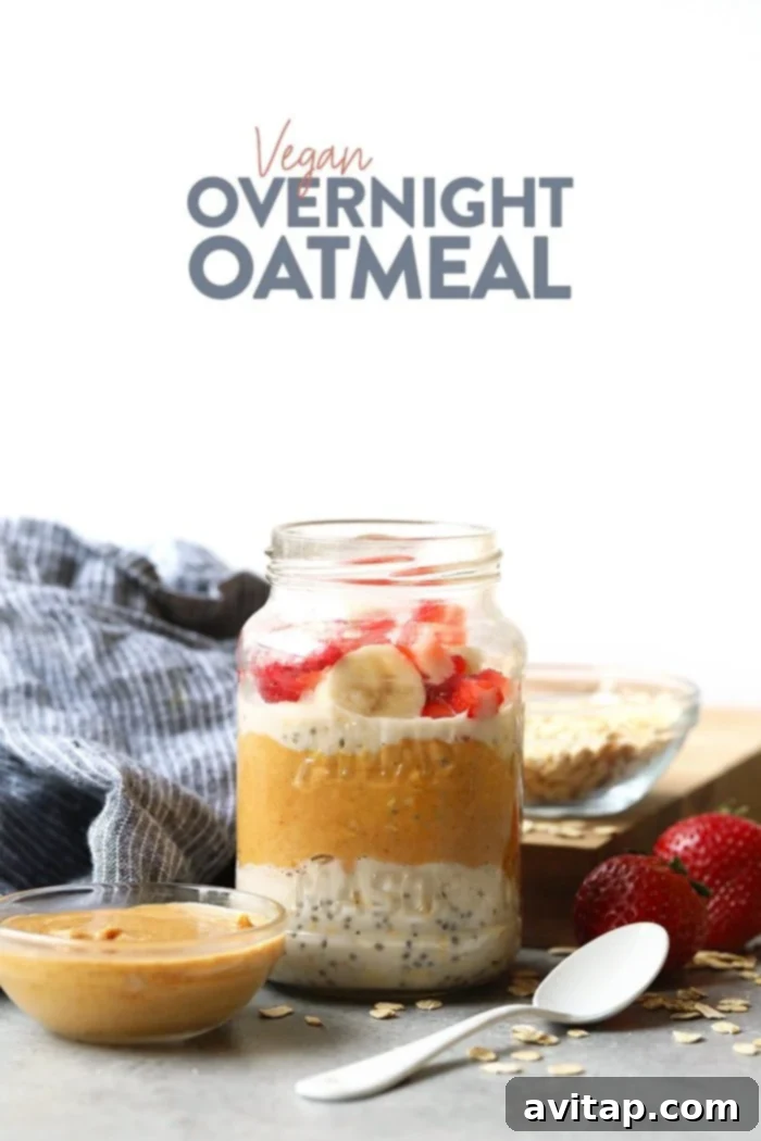 A jar of creamy vegan overnight oats, beautifully topped with fresh strawberries and banana slices, ready to be enjoyed.
