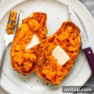 A sweet potato on a plate with butter.