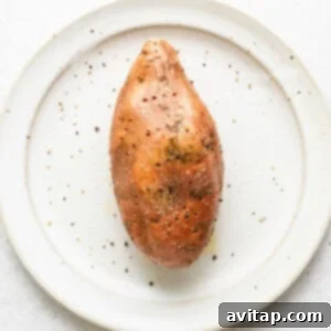 A sweet potato with holes on a plate.