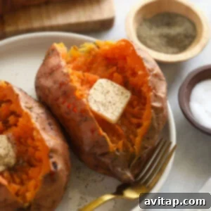 A vibrant display of fresh sweet potatoes on a plate, ready for cooking.
