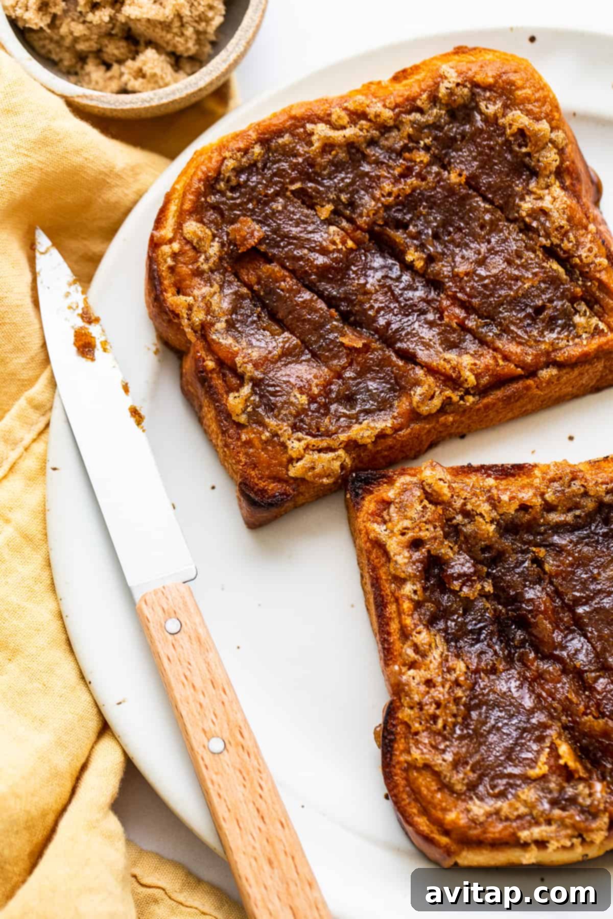 Decadent Pumpkin Creme Brûlée French Toast: The Ultimate Brunch Delight Exquisitely plated Pumpkin Creme Brûlée French Toast, showcasing its golden-brown caramelized top and soft interior.