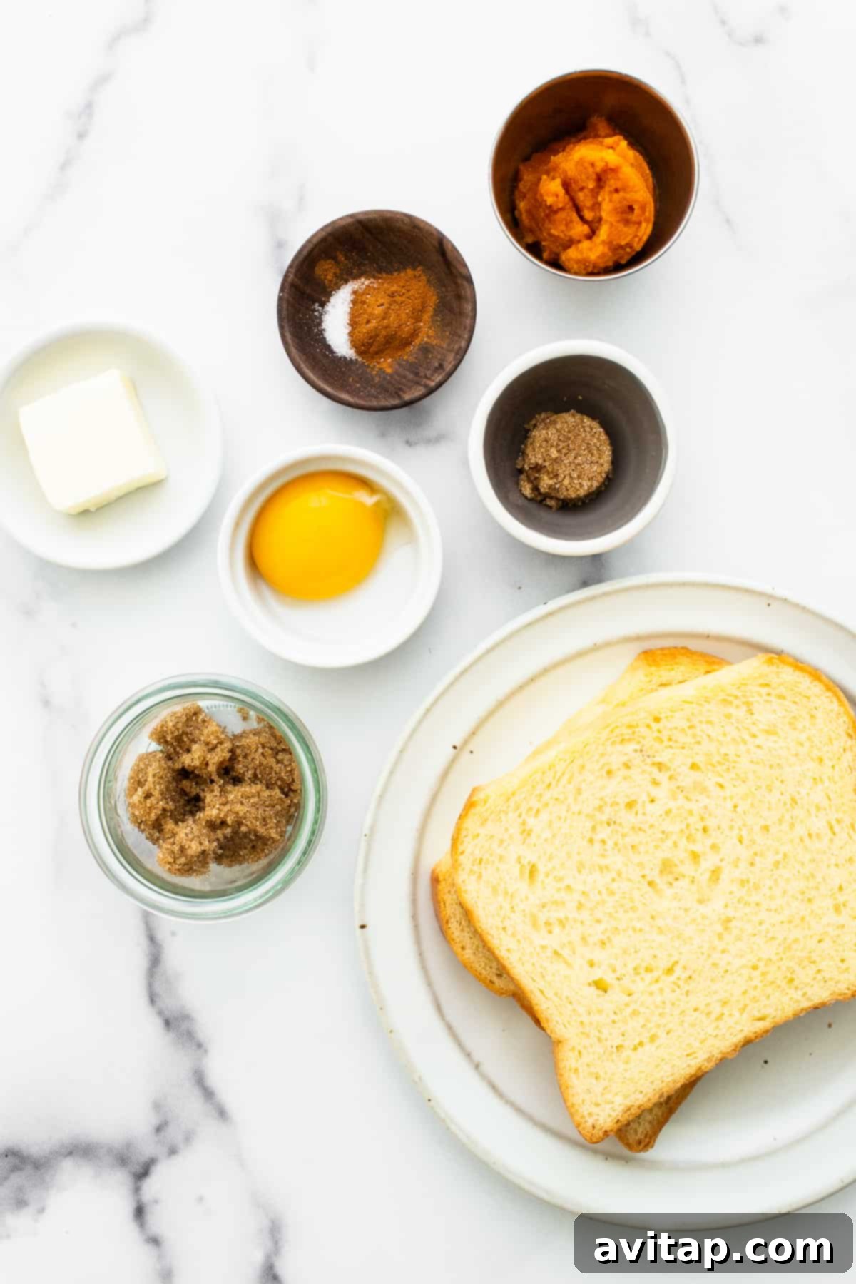 Fresh Ingredients for Pumpkin Creme Brûlée French Toast A collection of ingredients for pumpkin creme brulee french toast, neatly arranged in bowls.