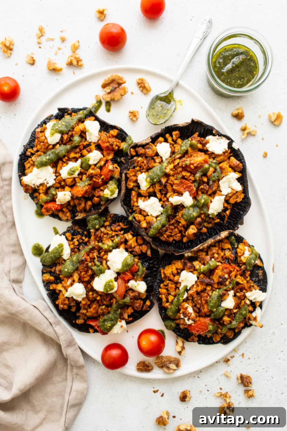 Portobello Stuffed Delights 2 Delicious Stuffed Portobello Mushrooms on a white plate, ready to be served.
