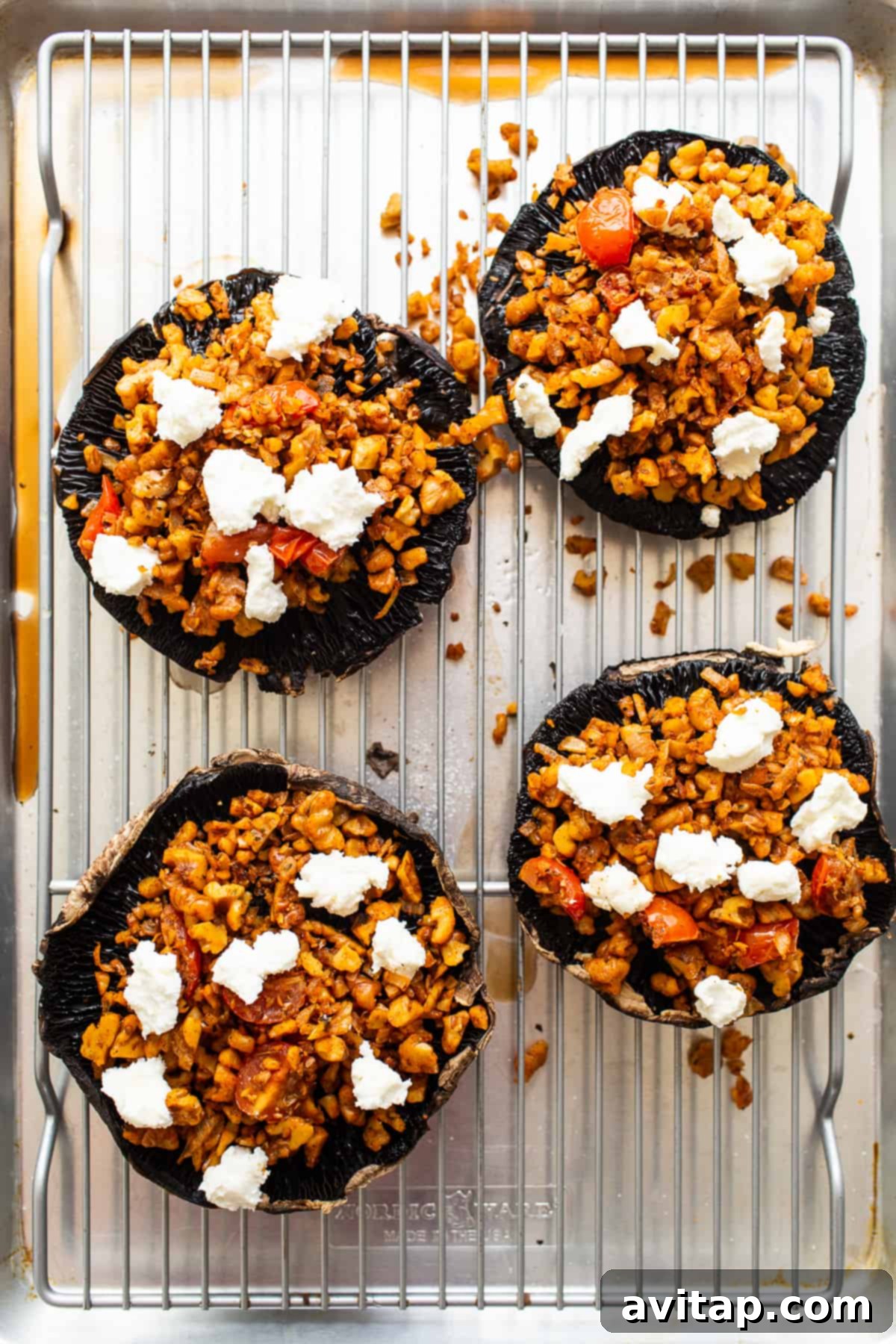 Savory Stuffed Portobello Caps 6 Stuffed portobello mushrooms with creamy goat cheese bubbling on top after broiling.