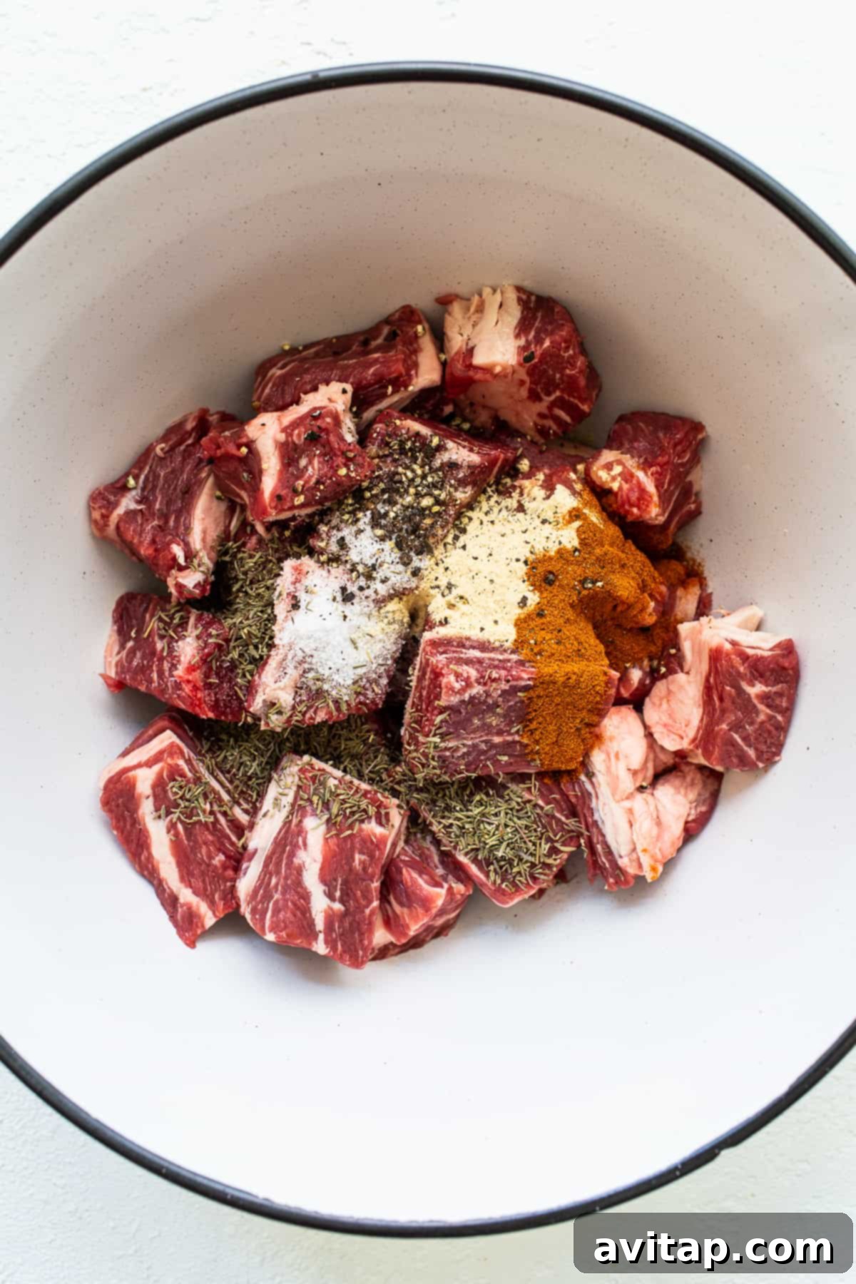 Chunks of beef chuck roast generously coated with a savory spice blend.