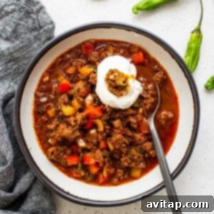 Texas Chili served with sour cream on top.