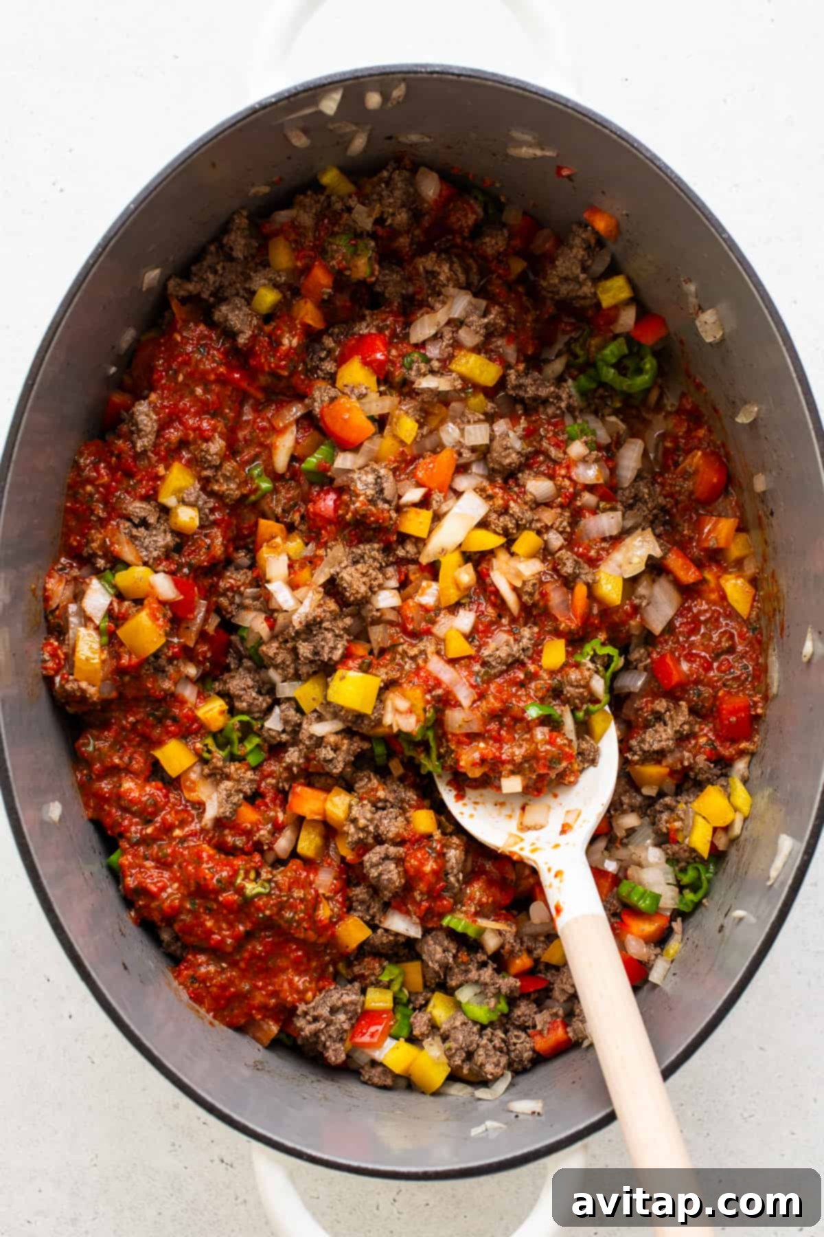 All the delicious ingredients for the Texas chili simmering together in a Dutch oven.