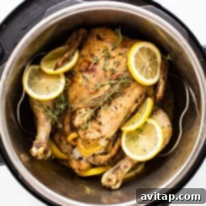 Instant Pot whole chicken with lemons, ready to be carved and served.