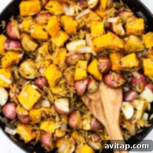 One-Pan Harvest Orzo Dinner 12 Butternut squash, red potatoes, and orzo mixed in a skillet.