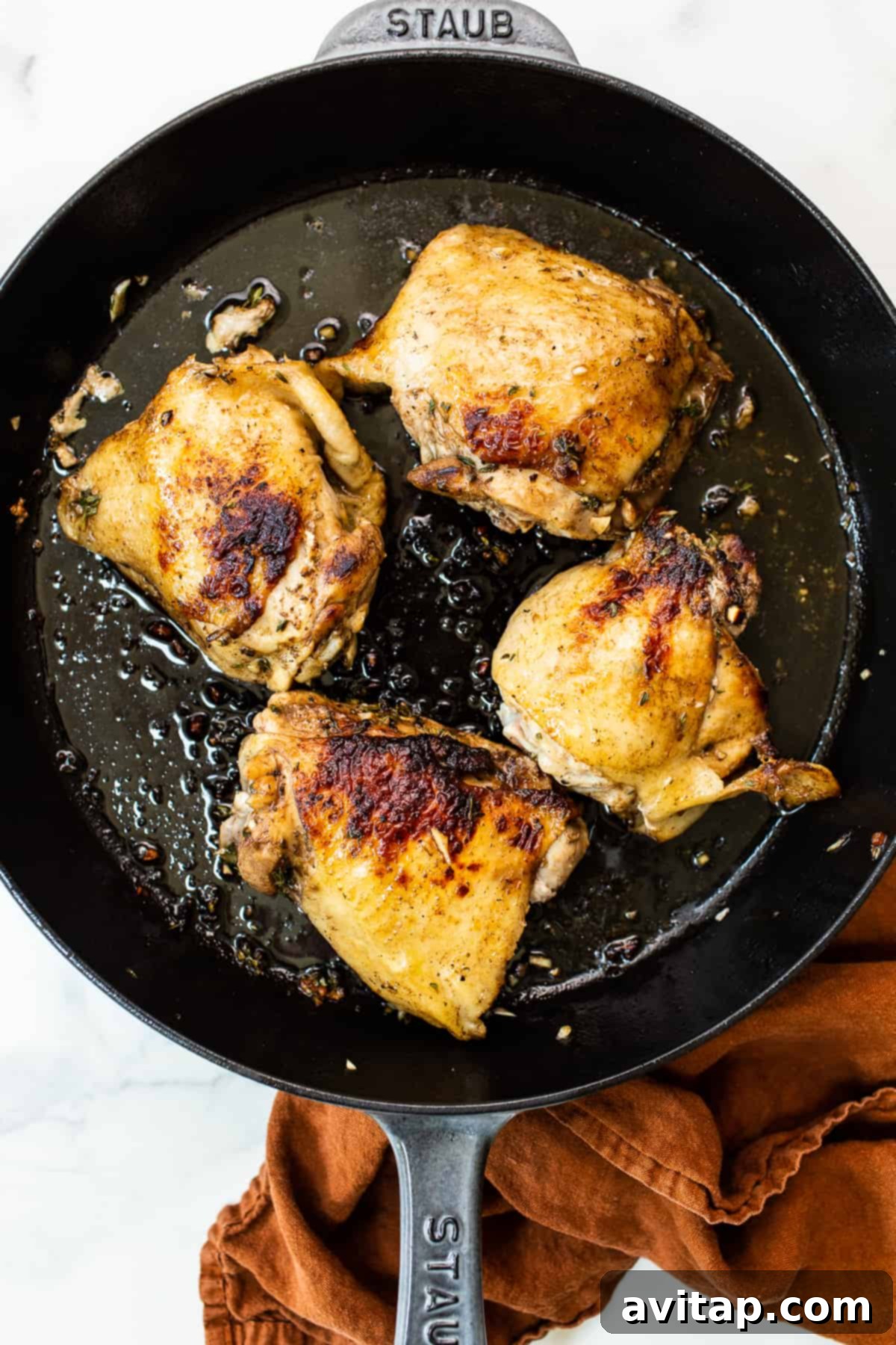 One-Pan Harvest Orzo Dinner 3 Browning chicken thighs to perfection in a hot cast iron skillet.