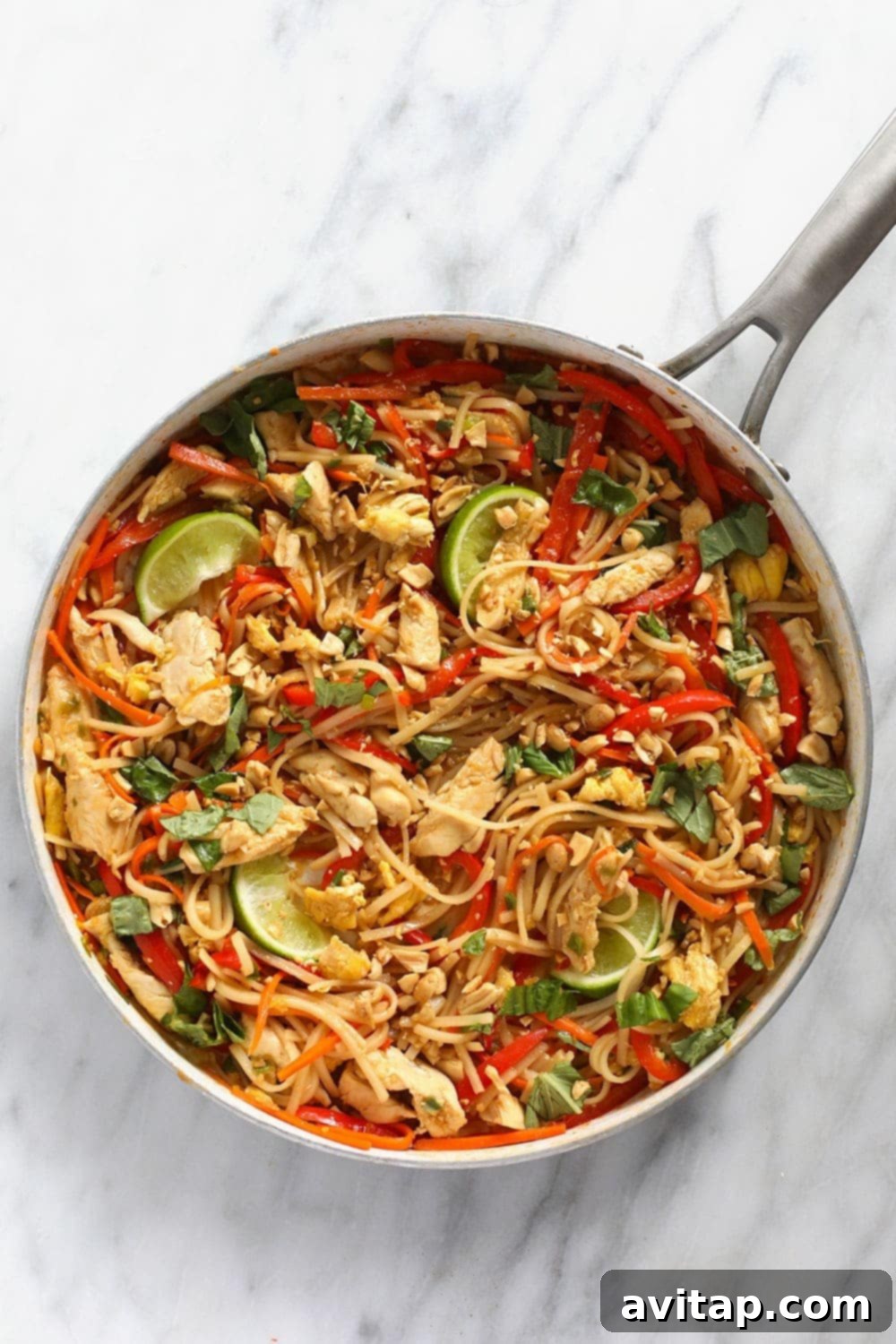 Delicious Chicken Pad Thai served fresh in a wok, ready to be enjoyed.