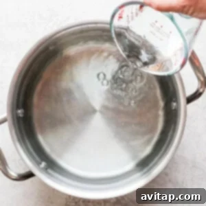 Adding water to pot.