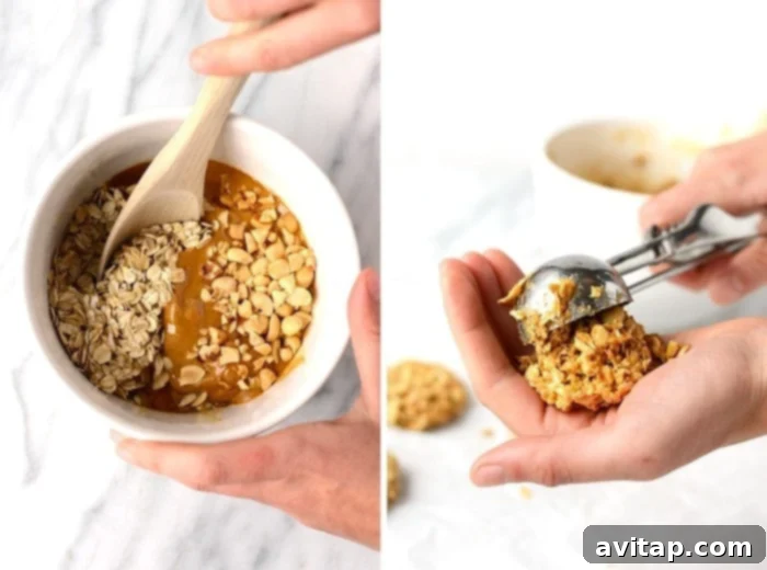 A spoon scooping healthy no-bake peanut butter oatmeal cookie dough onto parchment paper, ready for shaping and freezing.