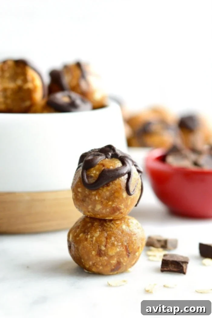 Stacked Peanut Butter Energy Balls: A Convenient and Wholesome Treat A stack of perfectly rolled peanut butter energy balls, showcasing their uniform size and inviting texture, ready for snacking.