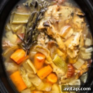 Homemade turkey stock nearing completion in the slow cooker.