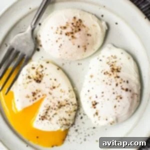 Perfectly cooked poached eggs with runny yolks and set whites.