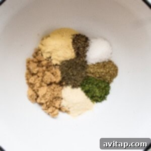 Spices in a bowl on a white surface.