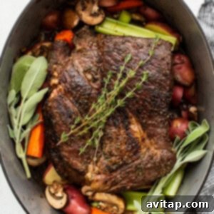 A pot full of vegetables and meat in a pan.