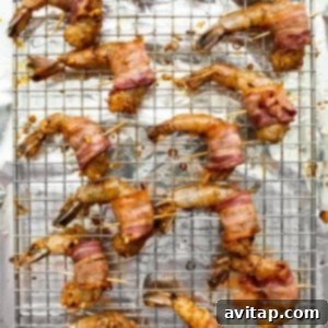 Bacon wrapped shrimp on skewers.