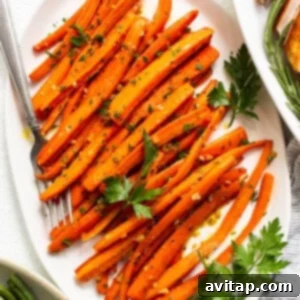 A close-up shot of delicious garlic glazed carrots in a bowl, ready to enjoy.