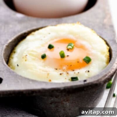A perfectly baked egg in a cast iron pan, ready for breakfast.