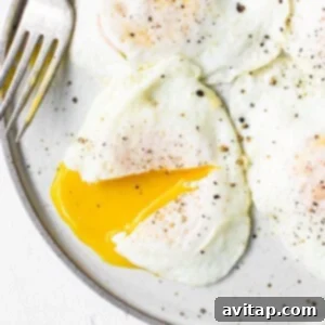 Perfectly Poached Eggs 7 Over easy eggs garnished and ready to eat.
