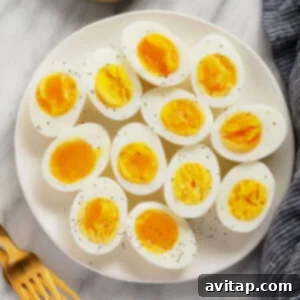 Hard boiled eggs on a cutting board, perfectly cooked.