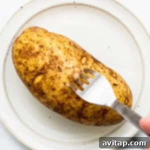 Poking holes in a potato.