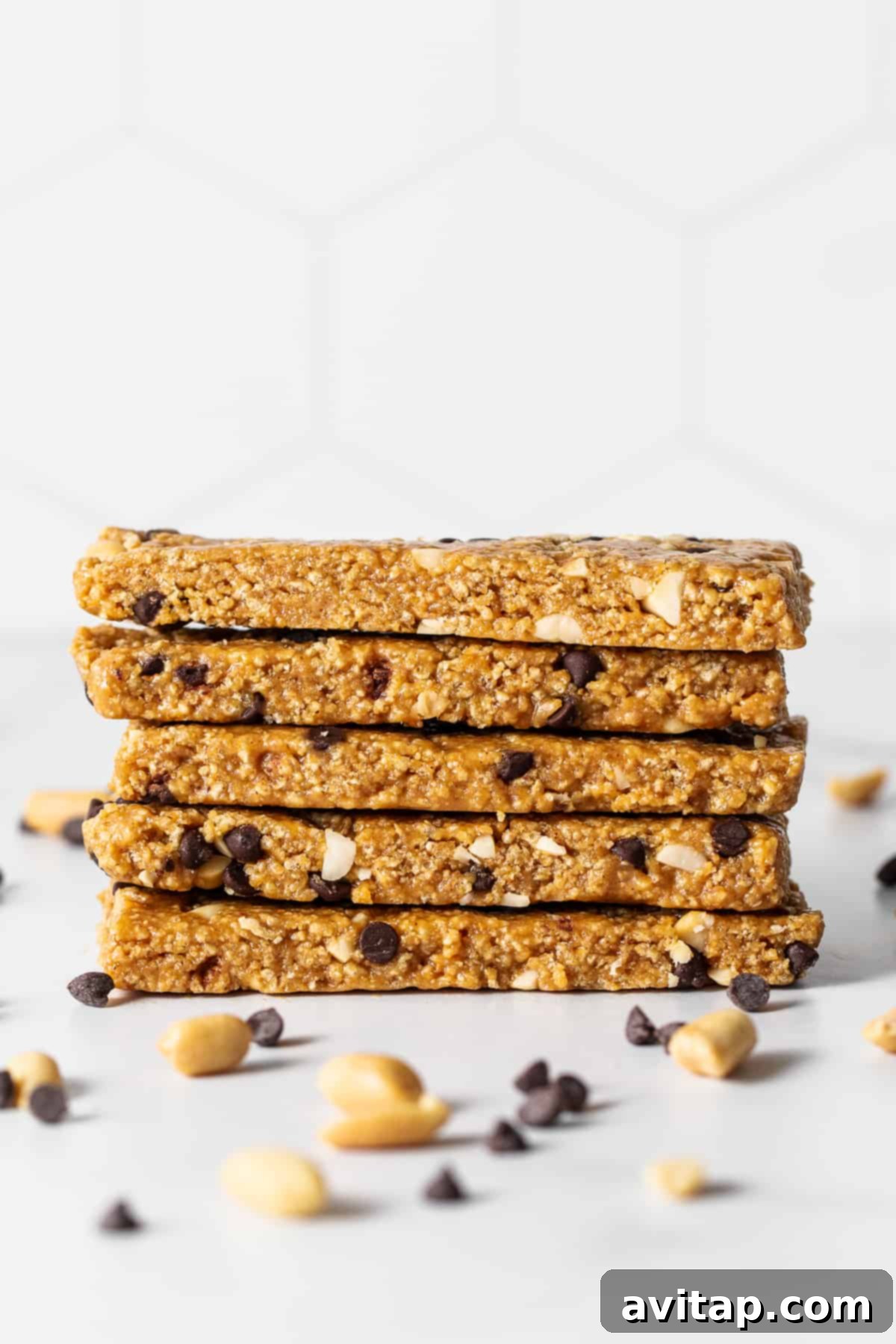 No bake peanut butter bars stacked on a plate.