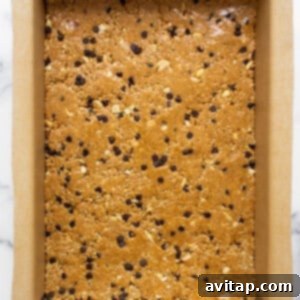 Chocolate chip cookie bars in a baking pan.