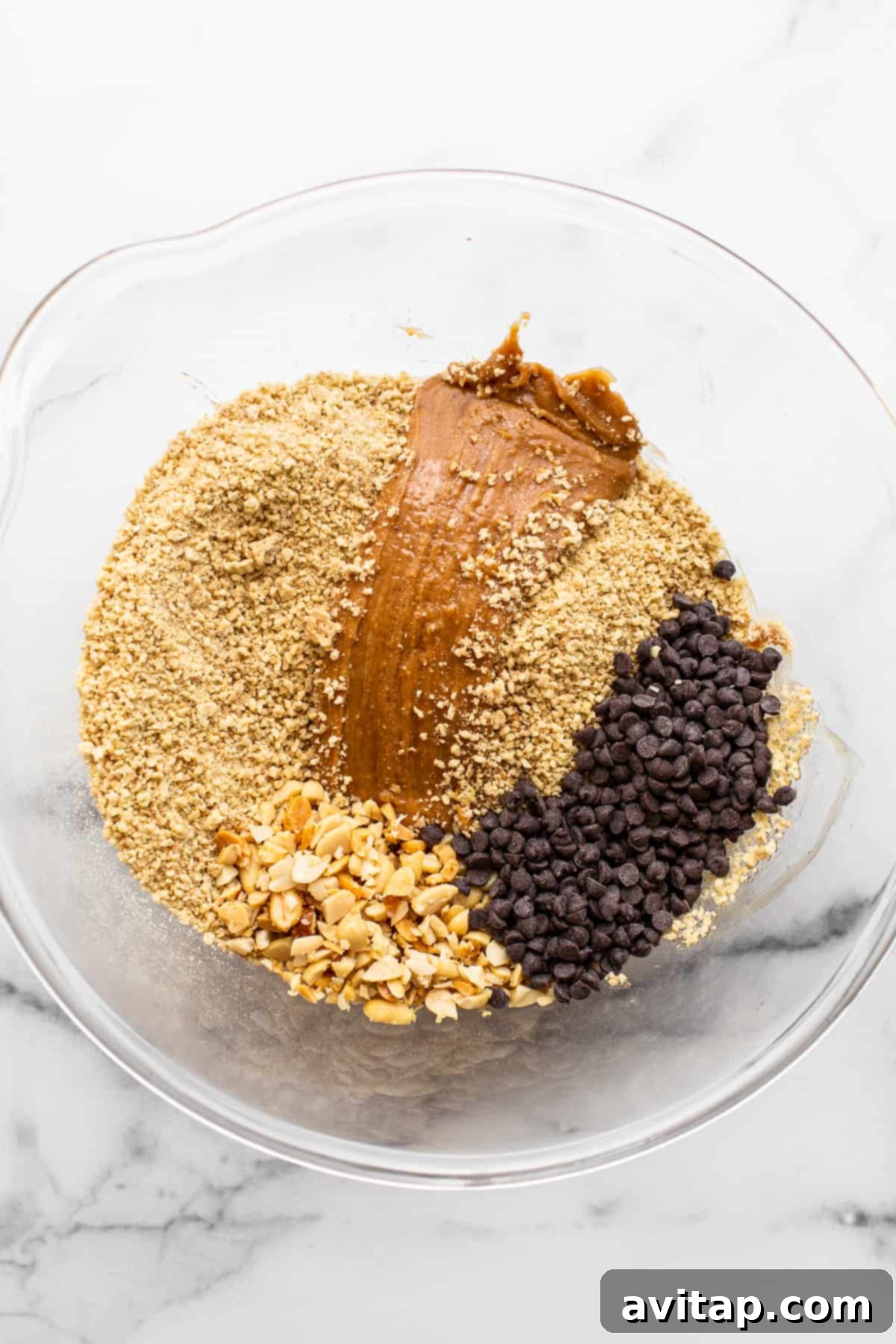 Ingredients for no bake peanut butter bars in a bowl.