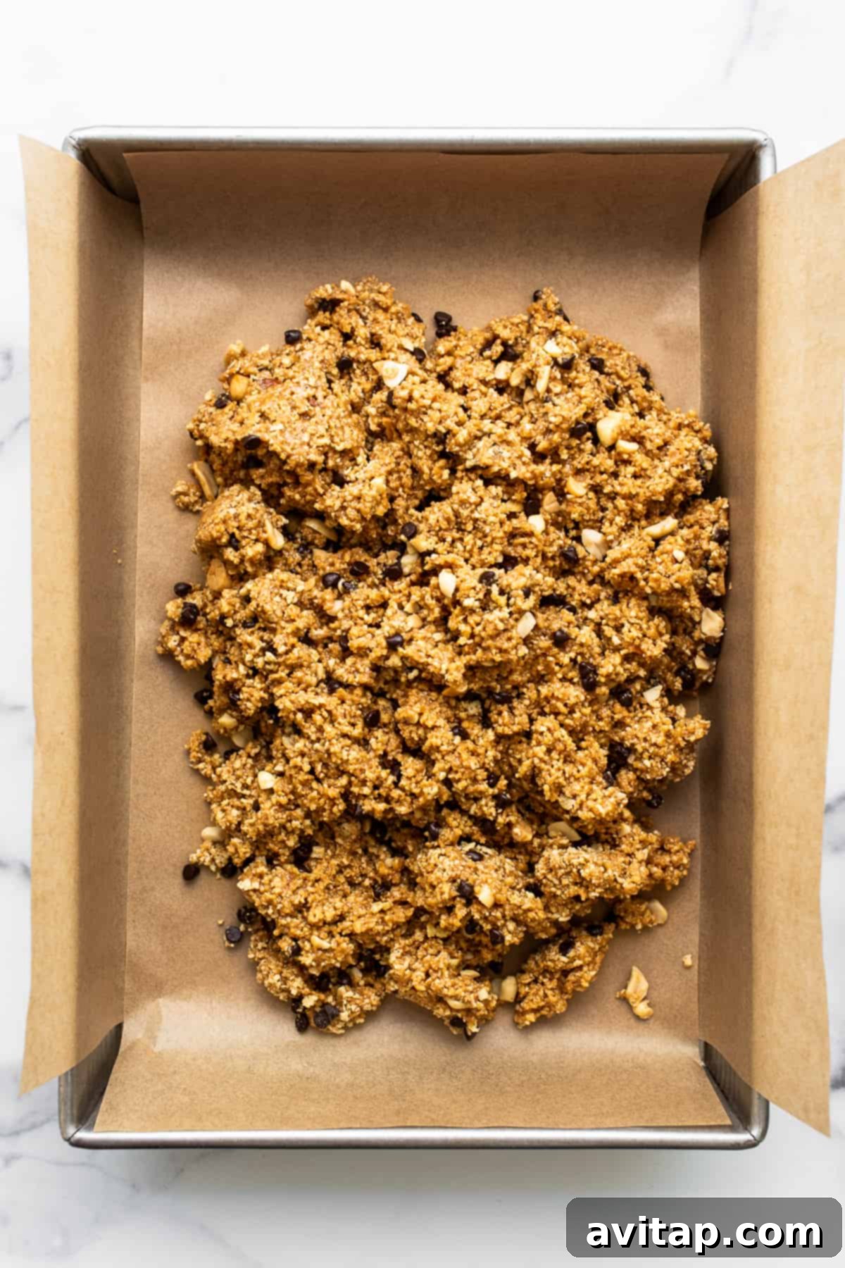 No bake peanut butter bar batter in a baking sheet.