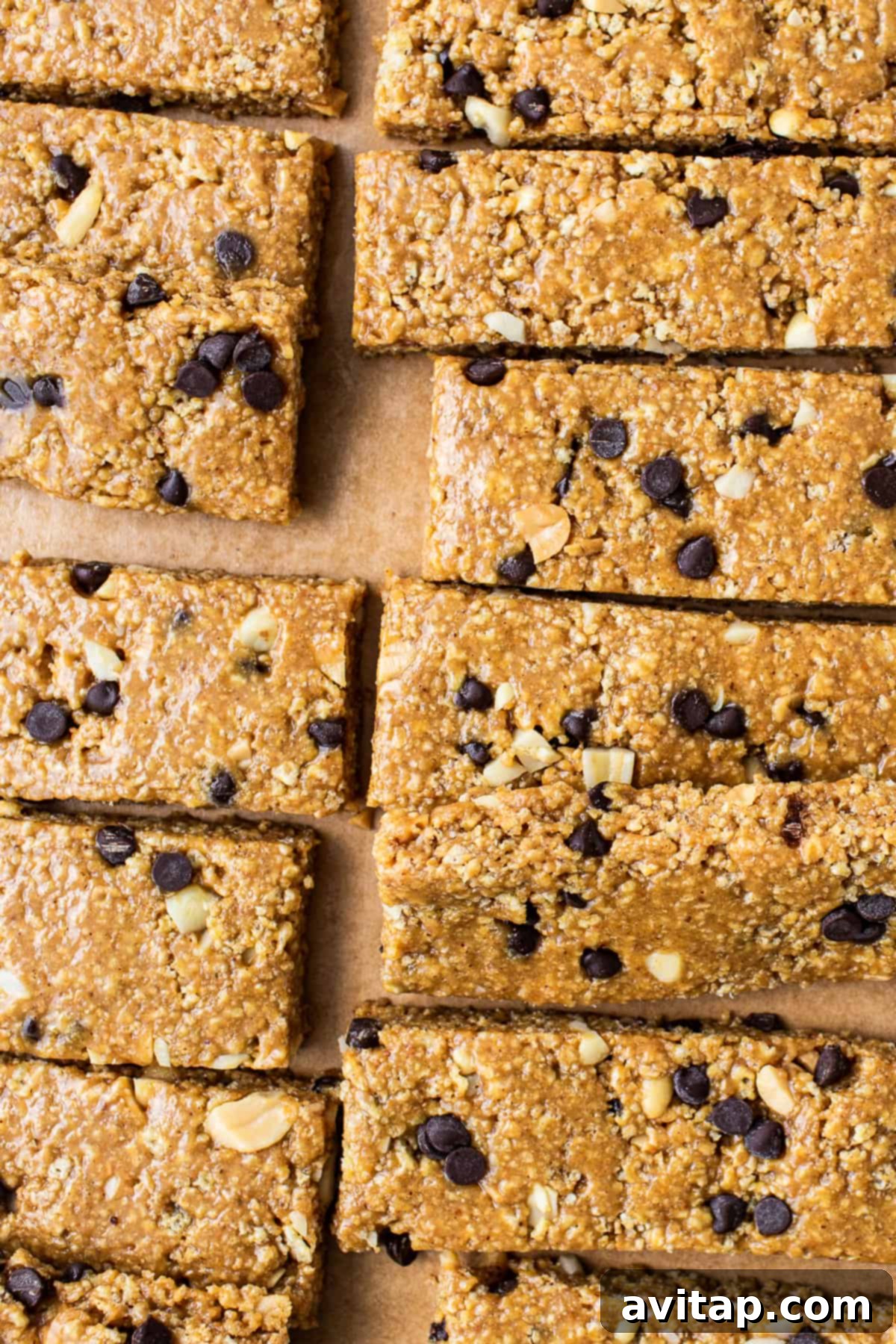 No bake peanut butter bars cut on parchment paper.