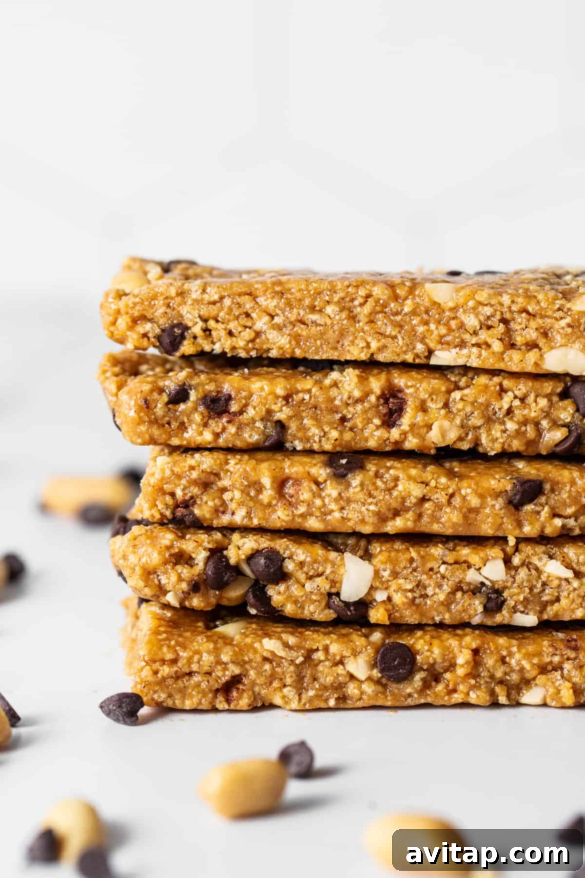 No bake peanut butter bars stacked on a plate.