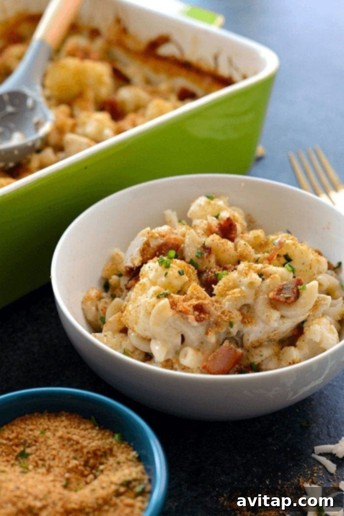 Creamy Cauliflower Chicken Mac and Cheese 5 Large mac and cheese casserole dish ready to serve, with a golden-brown top.