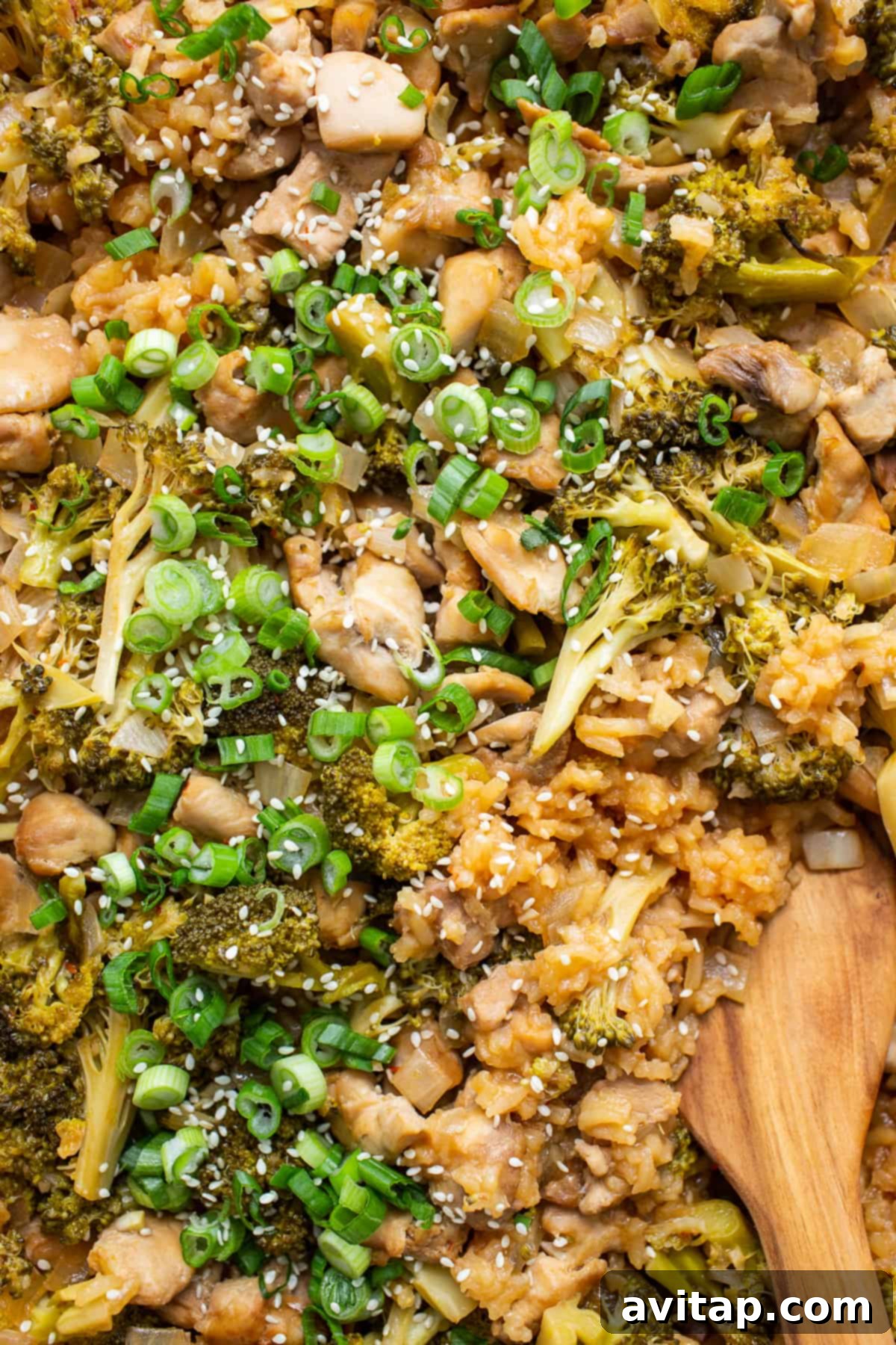 Hearty and healthy broccoli rice and chicken casserole. A wide shot of a broccoli rice and chicken casserole in a baking dish, freshly cooked.