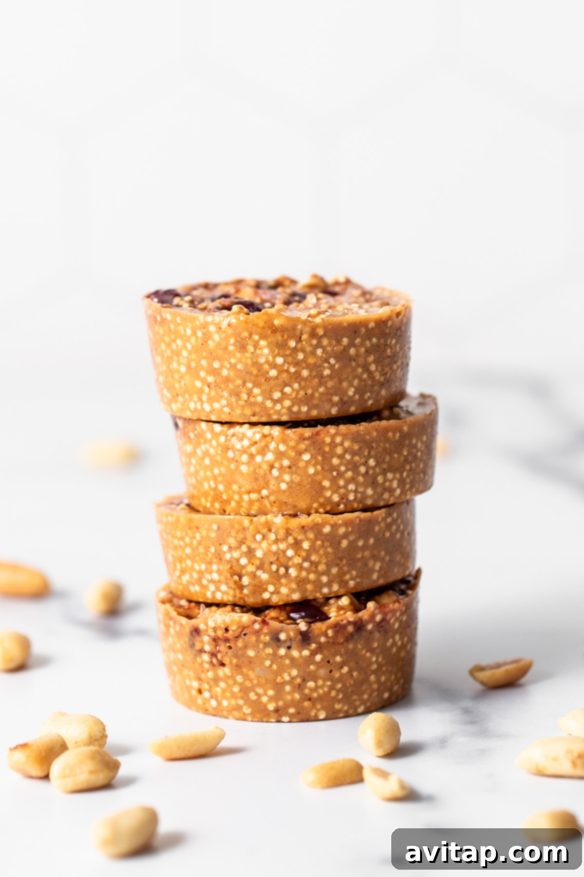 A stack of perfectly portioned peanut butter and jelly quinoa cups, ready to be devoured.