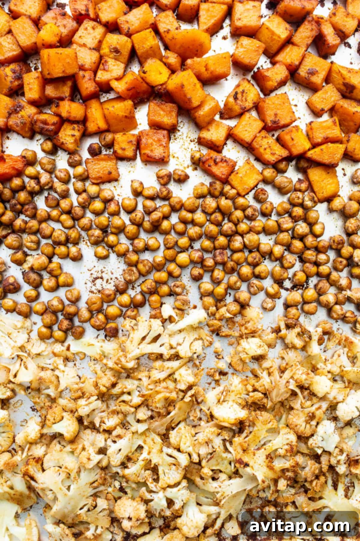 Israeli Couscous Medley 6 A baking sheet laden with roasted butternut squash, perfectly seasoned chickpeas, and tender cauliflower florets.