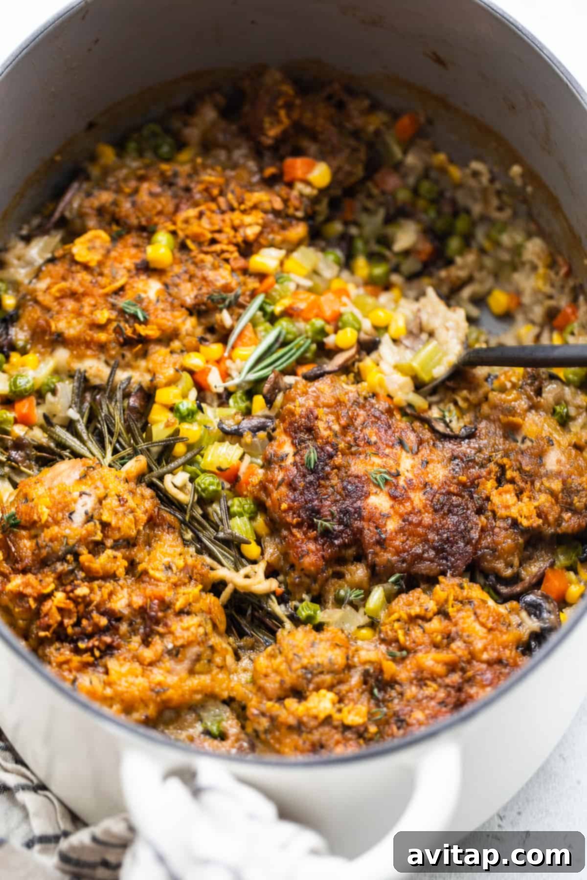 Serving a portion of chicken pot pie skillet from the pan.