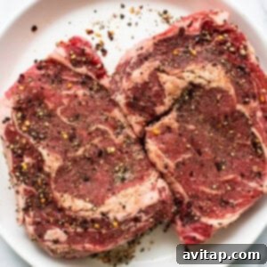 Dry rub generously applied to a raw steak.