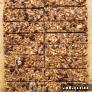 Sliced nut and coconut bars on a cutting board.