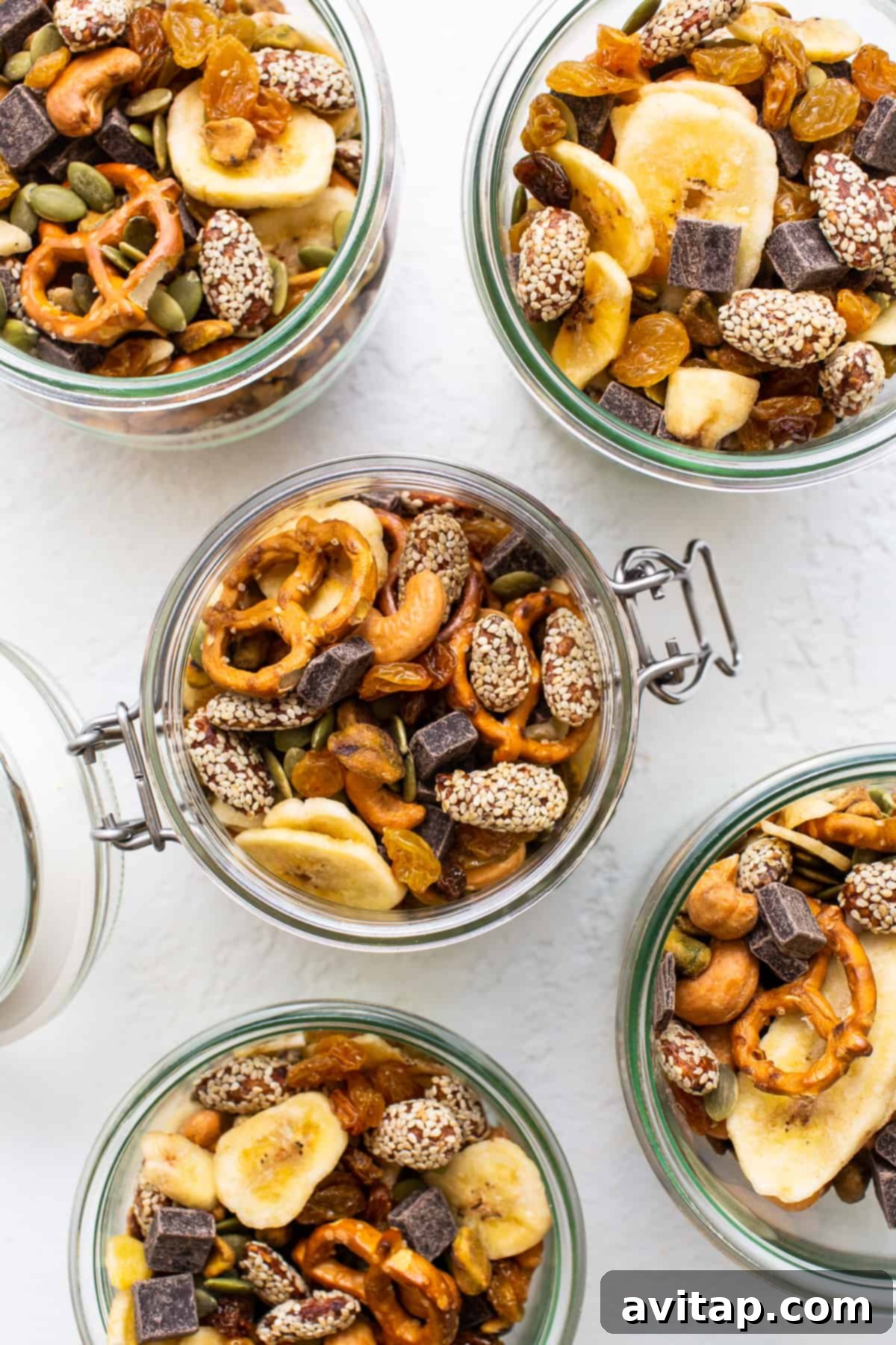 Homemade trail mix in mason jars.