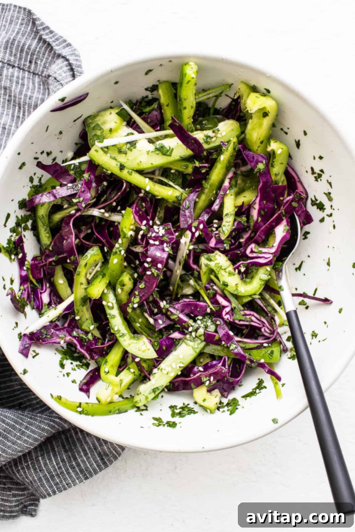 Freshly prepared vegetable slaw in a large mixing bowl, ready to be dressed or served.