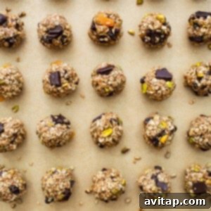 A baking sheet full of granola and pistachio energy bites.