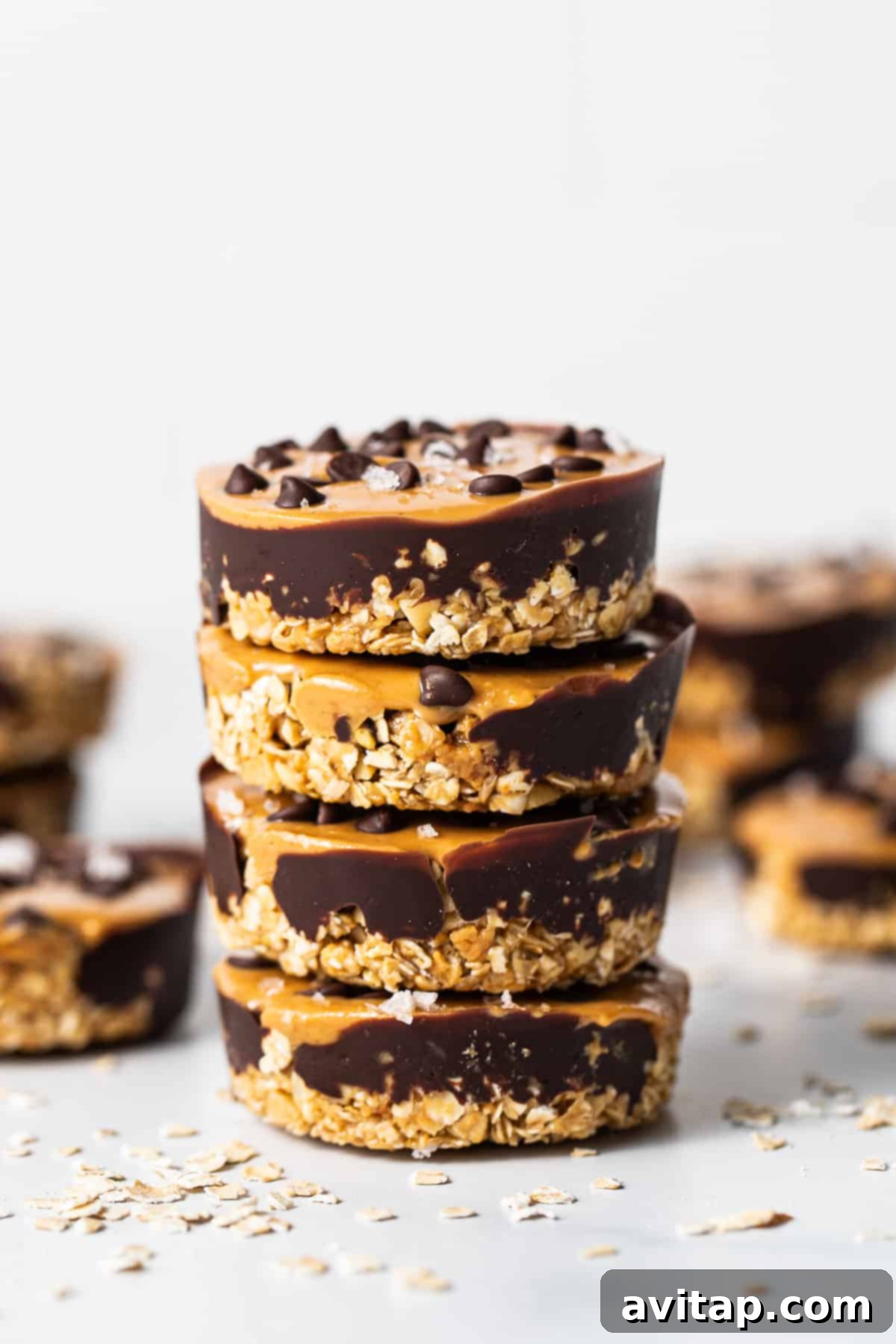 Stack of decadent no-bake peanut butter oat cups, showcasing their layers.