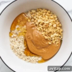 Mixed oat layer ingredients in a bowl.