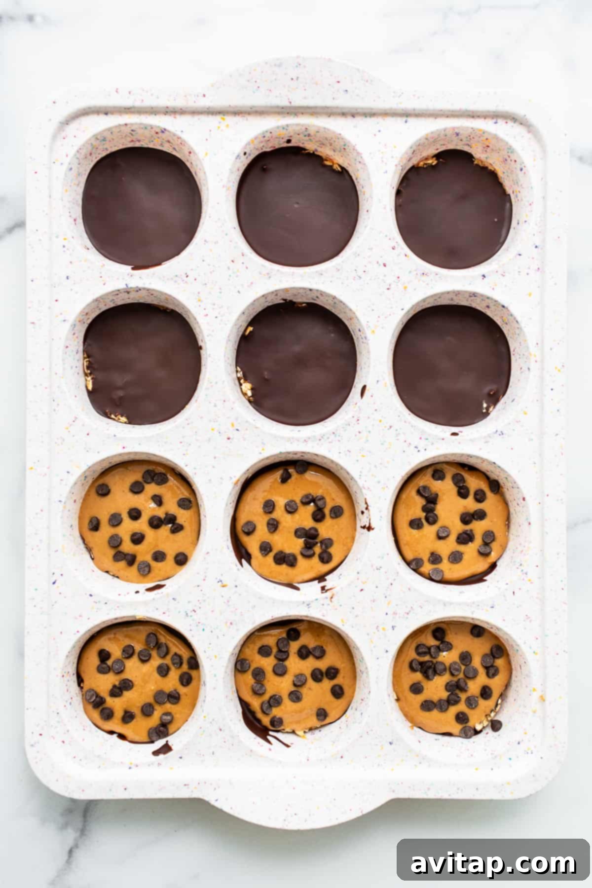 A tray of no-bake desserts setting in a muffin tin.