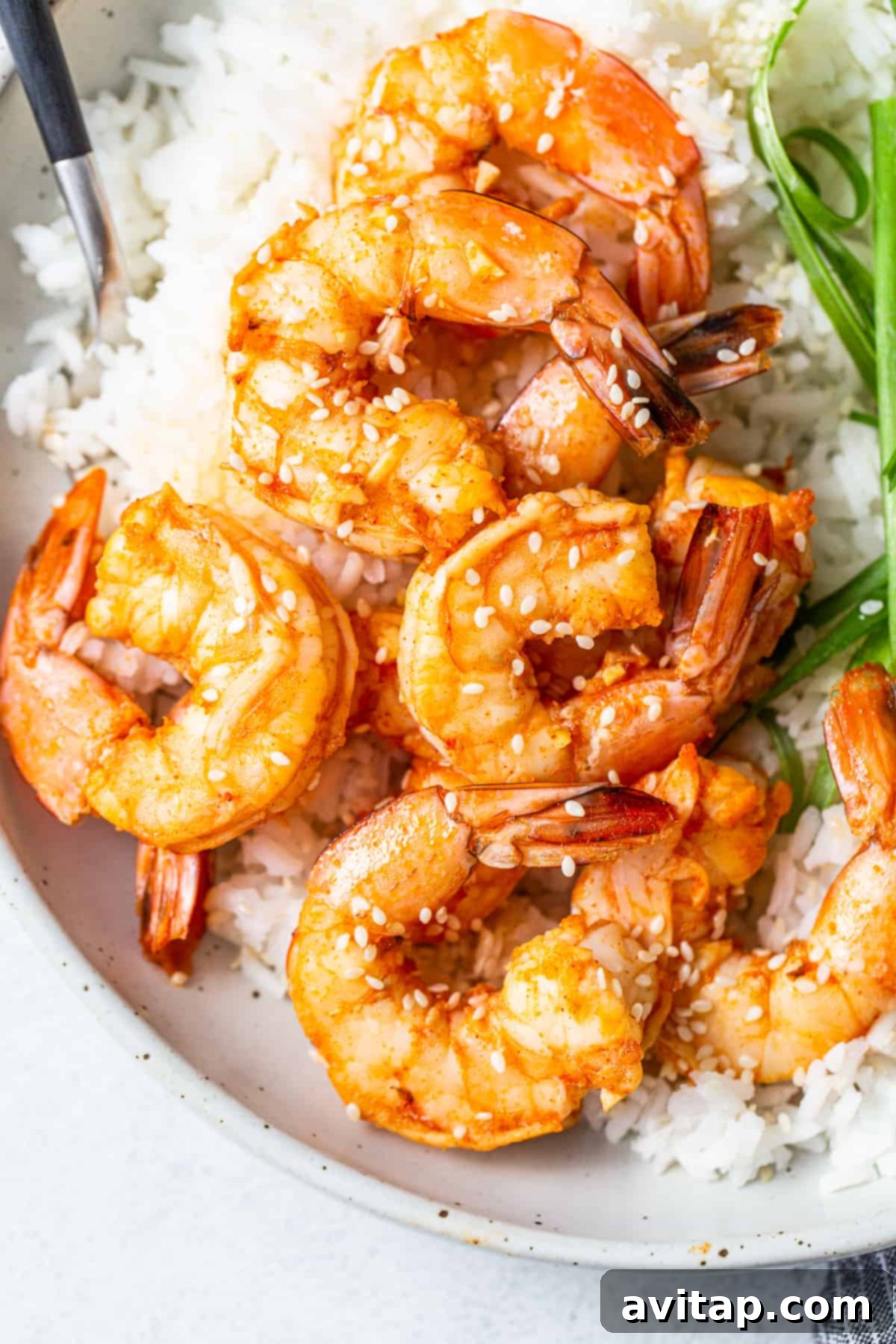 Spicy Garlic Prawns Ready to Serve A beautifully presented bowl of spicy garlic prawns with rice, ready to be enjoyed.